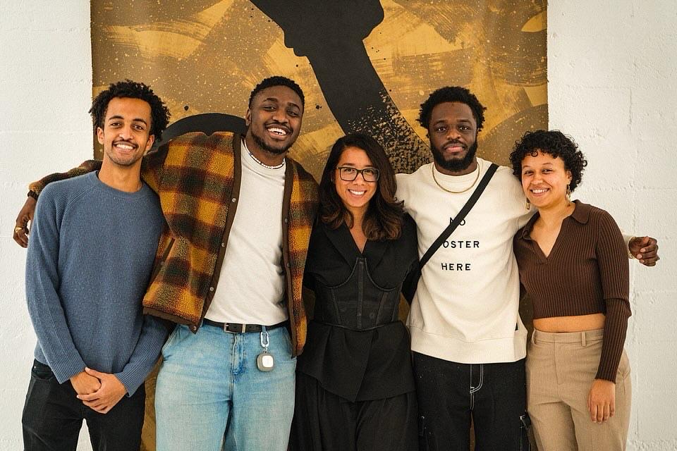Sam, with friends at an art community event.
